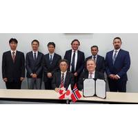 Below seated: KHI Managing Executive Officer, Takeshi Ohata; and Corvus Energy CEO, Geir Bjørkeli.Standing left to right: KHI—Tatsuya Onodera, Technical Manager; Tatsuya Ohno, Technical Manager; Takenori Hino, Senior Manager; Corvus— Per Erik Schumann-Olsen, Executive Advisor; Pradeep Datar, VP Sales – Asia; Sean Puchalski, EVP Strategy & Business Planning. Photo: Corvus Energy
