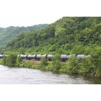 A crude oil train segment rumbles alongside a U.S. inland waterway. CREDIT: Dagmar Etkin