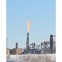 Gas flares from a stack in Utah's Uintah Basin. A new study by NOAA and CIRES scientists shows that chemicals released into the air by oil and gas activities can spark reactions that lead to high levels of ozone in wintertime, high enough to exceed federal health standards. (Credit: Scott Sandberg, NOAA)