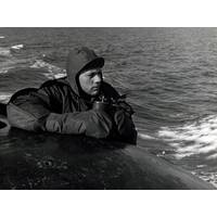 Lookout on the bridge of USS Nautilus (SSN 571) keeps an alert watch for pieces of ice as the Nautilus presses closer to the Polar Ice Cap, August 1958. (NHHC Photograph Collection, L-File, Ships)