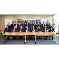 Nikolay Kolesnikov, Senior Executive Vice-President and CFO of Sovcomflot (sitting in the centre) together with the signees from KfW IPEX-Bank, Credit Agricole, ING Bank, Societe Generale, Citibank, UniCredit, and DVB Bank (sitting, from left to right). Photo: Sovcomflot