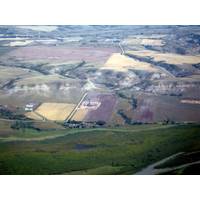 Oil-well pads dotting the landscape of typical badland topography. Thousands of new wells are drilled into the Bakken and Three Forks annually, making this one of the most productive plays in the Nation. (Source: USGS)