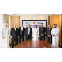 Qatargas CEO Khalid Bin Khalifa Al-Thani (fifth from Left), United Arab Shipping Company CEO Jorn Hinge (fourth from Left), and Managing Director and Chairman of Qatar Shell Companies, Michiel Kool (sixth from left) pose for a photograph along with other officials after the signing ceremony