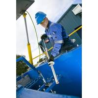 ROMAR employee working on a swarf handling unit