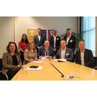 Stork’s Carla Rodenburg together with Lex de Groot, Neptune Energy, and Worley’s Jim Lenton sign a four-year engineering services agreement for Dutch assets in the North Sea. (L to R with pens in hand) (Photo: Business Wire)