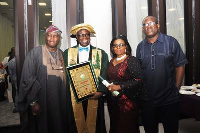 L-R: Assistant Director, Maritime Safety, Nigerian Maritime Administration and Safety Agency (NIMASA) Engineer Olu Aladenusi, FNSE, Executive Director, Operations, NIMASA, Engr. Rotimi Fashakin, FNSE, His Wife Mrs. Olubisola Fashakin and Head, Corporate Communications, NIMASA, Mr. Isichei Osamgbi at the conferment of the Fellowship status to the NIMASA ED, Operations by the Nigerian Society of Engineers in Abuja recently.  (Photo courtesy of NIMASA)