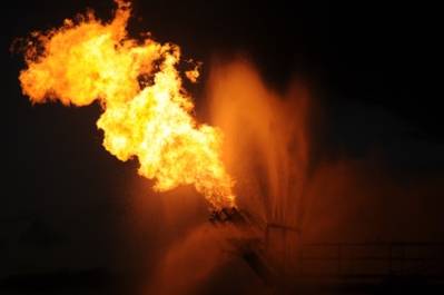 Gas from the damaged Deepwater Horizon wellhead is burned by the drillship Discoverer Enterprise in May 2010, in a process known as flaring. (U.S. Coast Guard photo by Patrick Kelley)