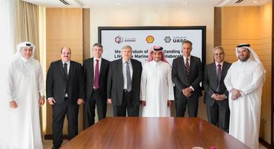 Qatargas CEO Khalid Bin Khalifa Al-Thani (fifth from Left), United Arab Shipping Company CEO Jorn Hinge (fourth from Left), and Managing Director and Chairman of Qatar Shell Companies, Michiel Kool (sixth from left) pose for a photograph along with other officials after the signing ceremony