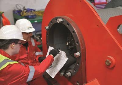 Sparrows experts checking hydraulic and mechanical setup of crane hoist winch after refurbishment.