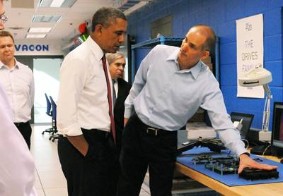 Rod Washington, Sr. Development Engineer, Vacon Inc. demonstrates AC drive energy efficiency principles to President Obama. Behind (left), Dan Isaksson, Vice President, Medium Voltage Drives, Vacon, and Dr. Ernest Moniz, United States Secretary of Energy.