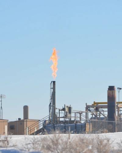 Gas flares from a stack in Utah's Uintah Basin. A new study by NOAA and CIRES scientists shows that chemicals released into the air by oil and gas activities can spark reactions that lead to high levels of ozone in wintertime, high enough to exceed federal health standards. (Credit: Scott Sandberg, NOAA)