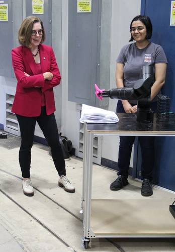 An Oregon State student shows Gov. Brown a robotic arm. (photo: Theresa Hogue)